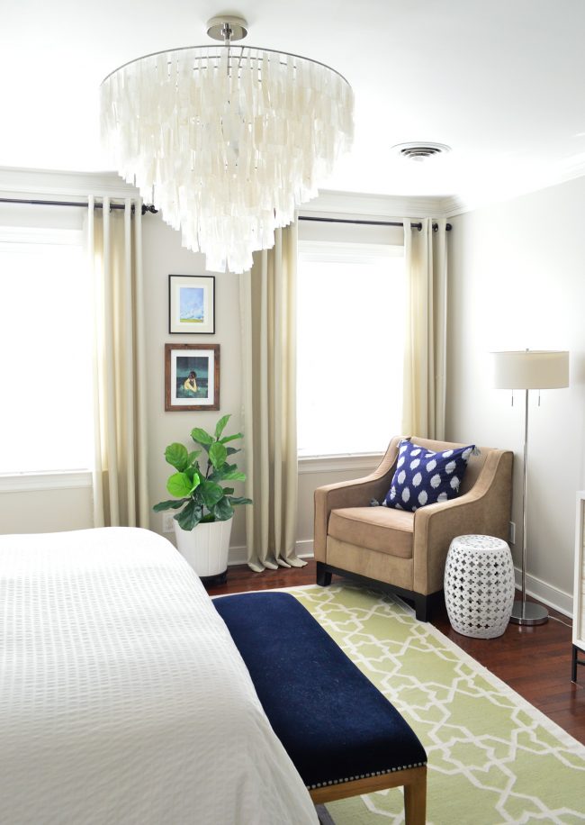 Neutral Bedroom Capiz Chandelier Over Sitting Area