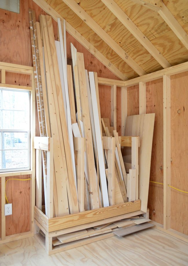 scrap wood storage system in unfinished shed