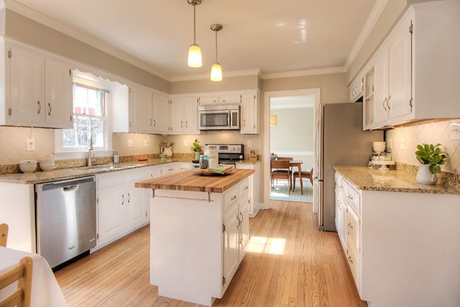 kitchen prepared to sell with painted cabinets and painted backsplash