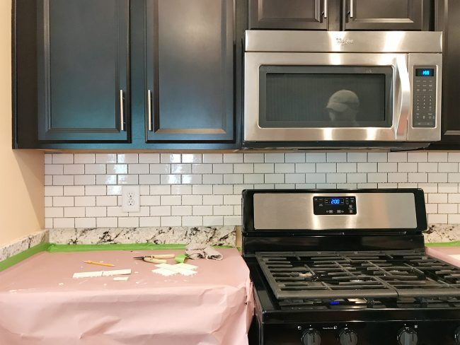 kitchen backsplash with subway tile hung but not grouted