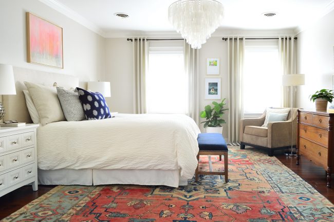 previous master bedroom with bedskirt and tan headboard