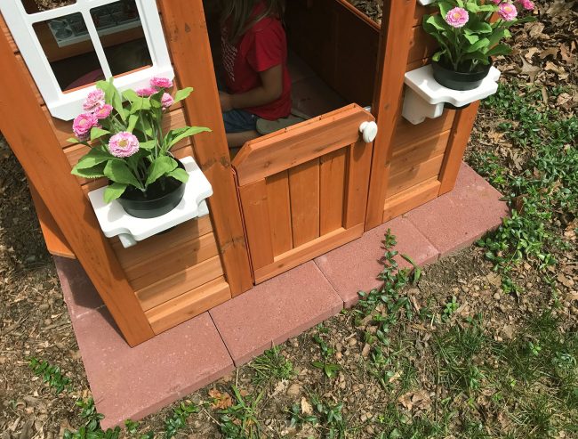 backyard discoveries cedar wooden playhouse with red paver base