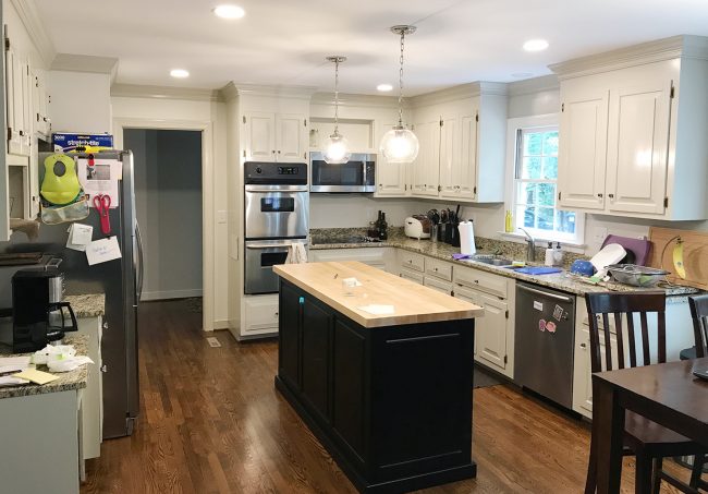 before photo of kitchen with lots of clutter and objects on counter