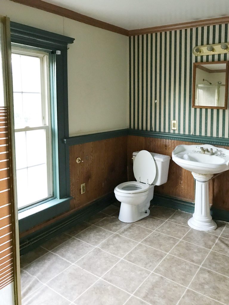 Before Photo Of Bathroom With Striped Wallpaper and Wood Paneling