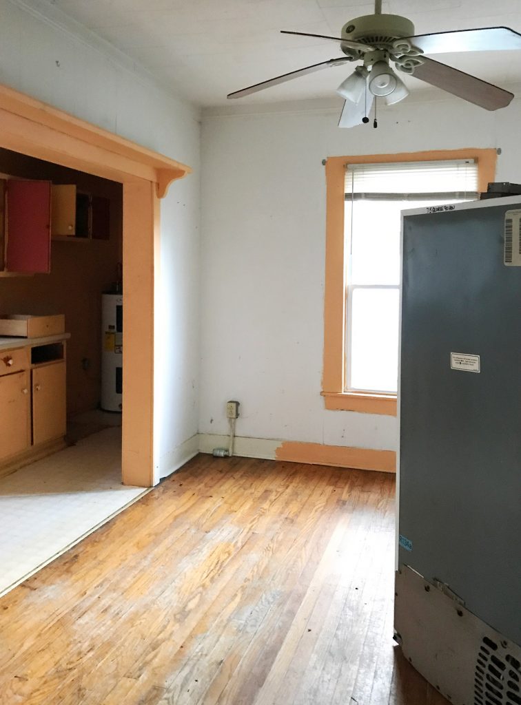 Before Photo Of Kitchen Dining Area With Orange Trim And Old Fridge