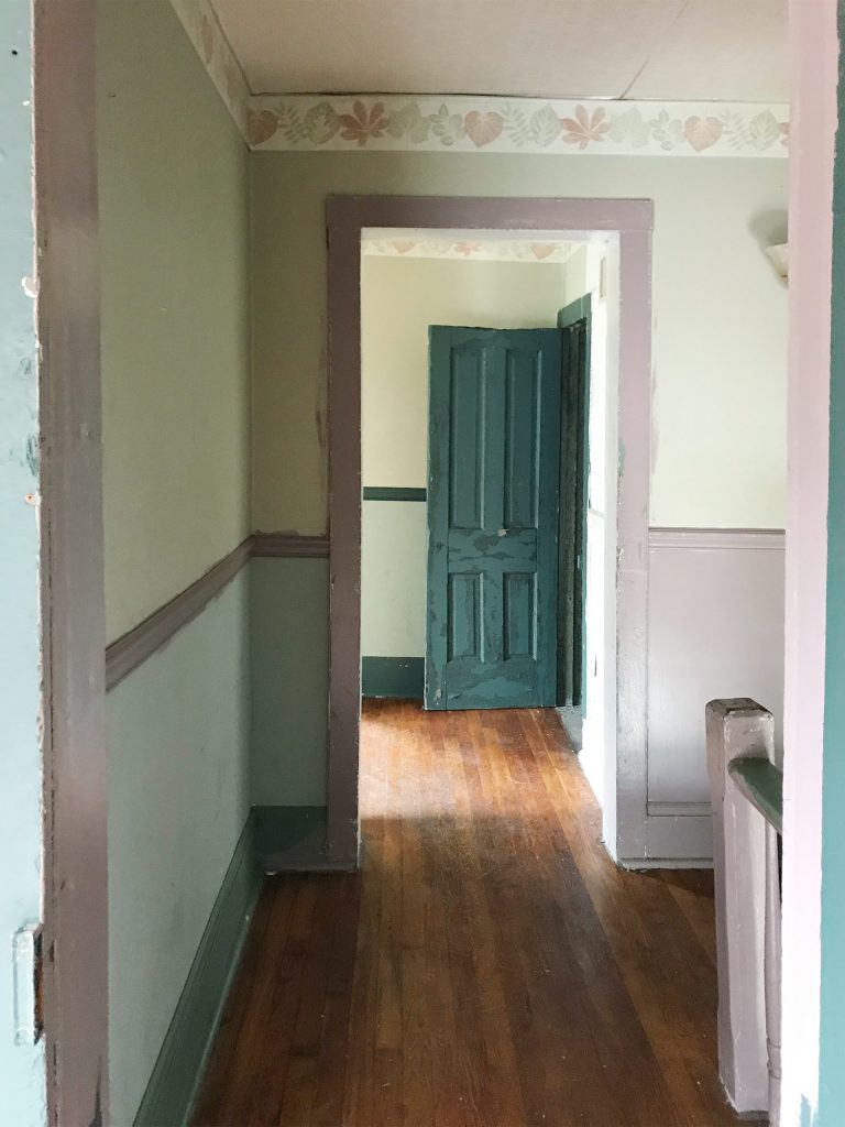 Before Photo Of Bedroom As Seen From Hallway With Pink Trim