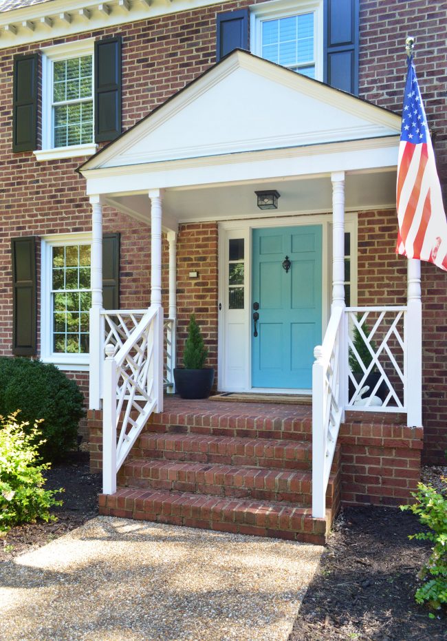 Front Porch With Teal Blue Door Fake Plants