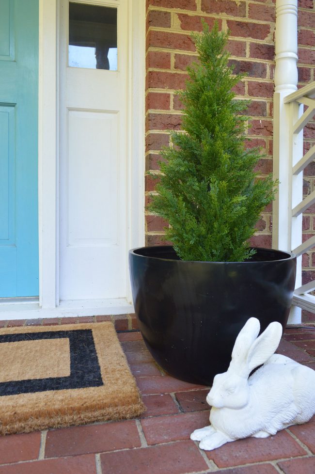 Fake Plant Evergreen In Black Planter On Front Porch