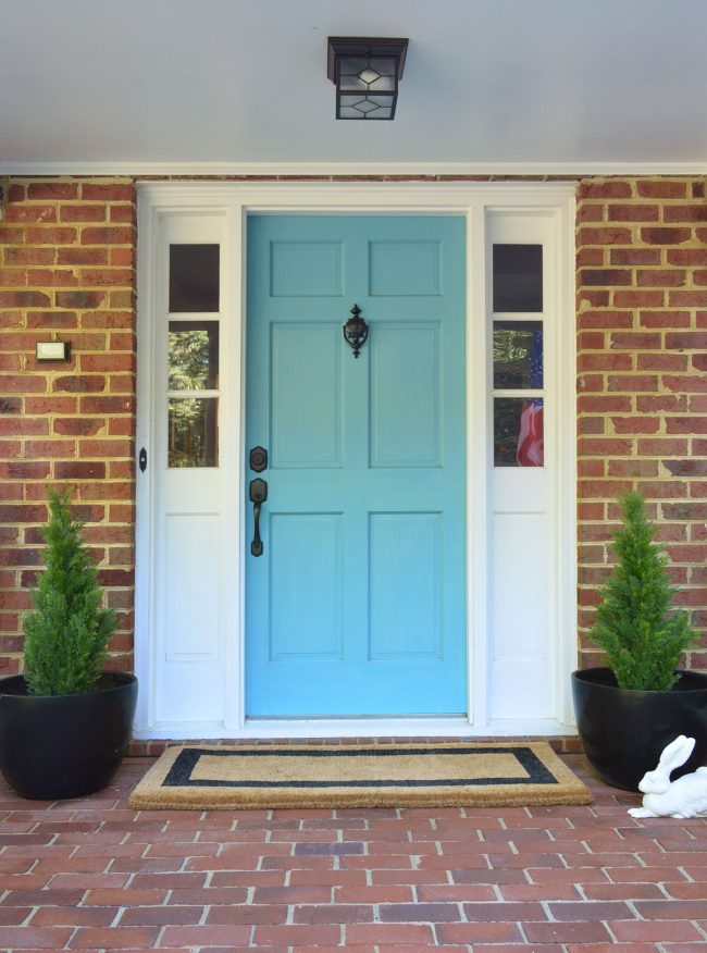 Front Porch With Fake Plant Evergreens