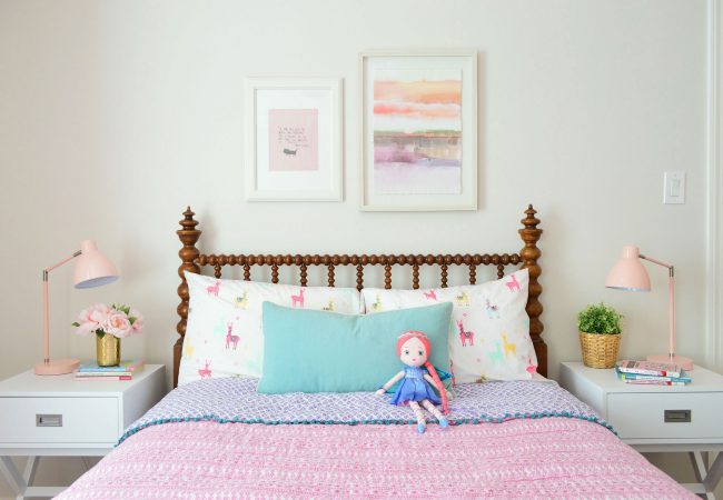 girls bedroom wooden headboard art above bed