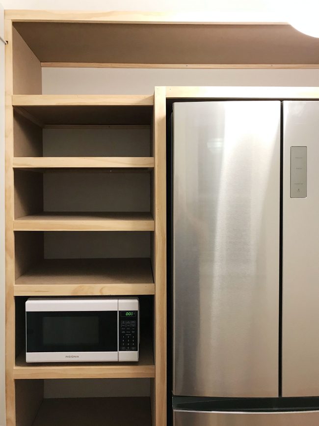 left side of built in pantry shelving with all face pieces installed