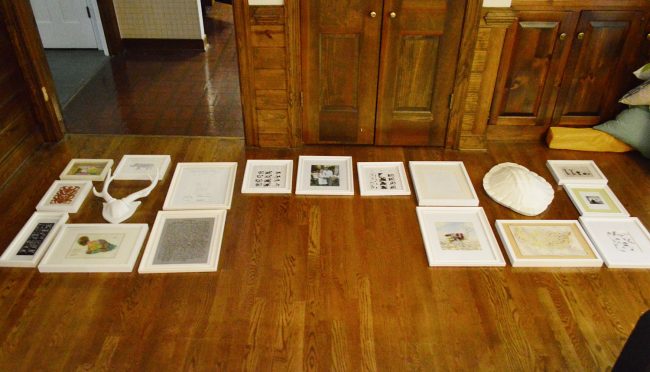 picture frames laid out on a floor in preparation for gallery wall