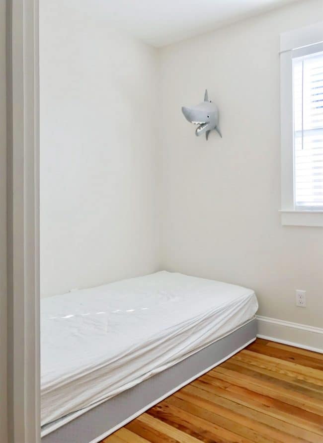 before shot of mattress on floor in bunk room