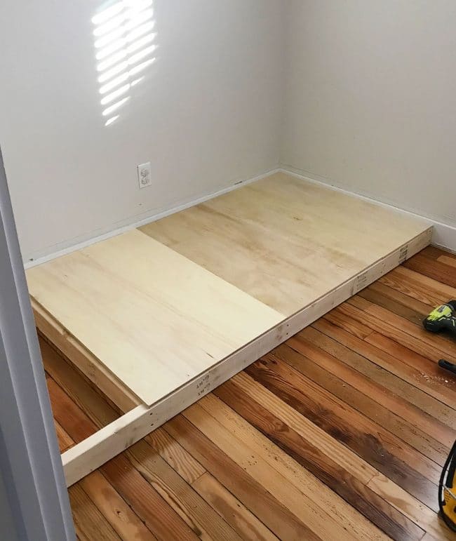 adding plywood to create base of bottom bunk bed