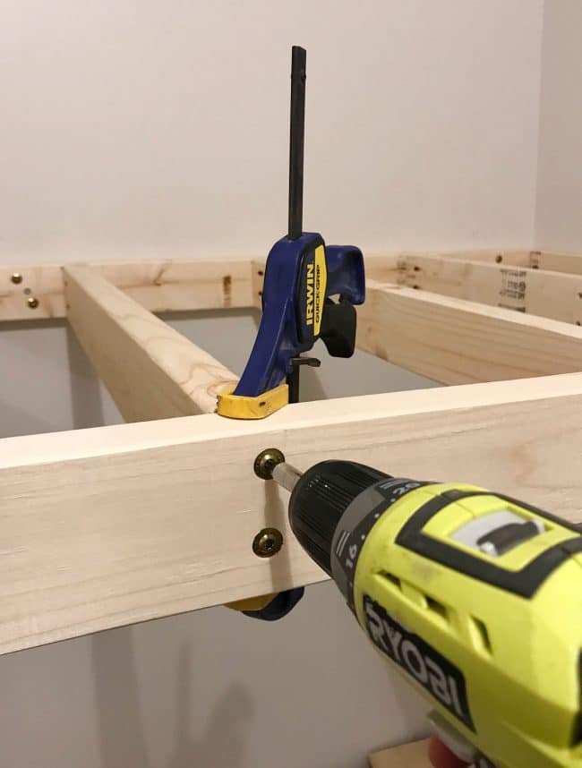 using clamps to drill top bunk supports into place