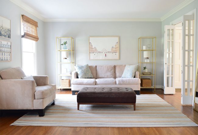 neutral living room staged to sell with some seating removed and simplified accessories