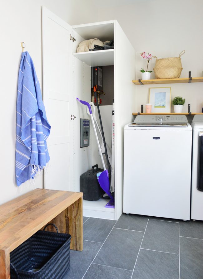 ikea pax wardrobe used for laundry storage cabinet open with access to water heater