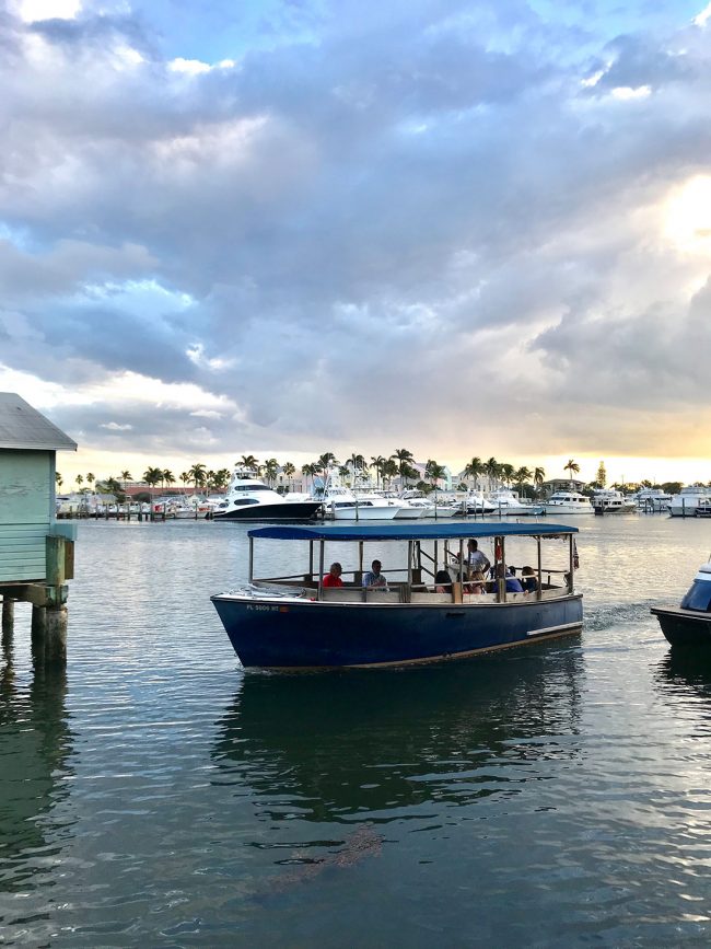 small boat picking up diners for Cap's Place Restaurant in Lighthouse Point Florida