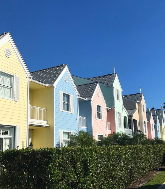 row of colorful pastel townhouses in lighthouse point florida