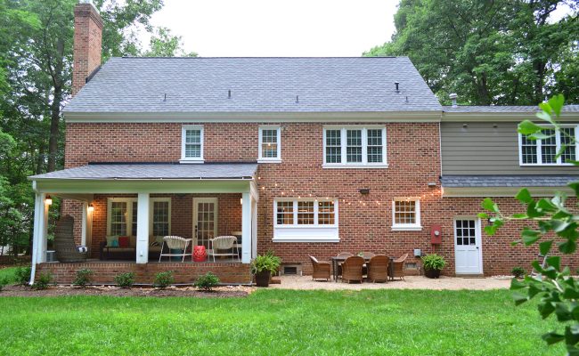 before photo of brick house back with garden lights