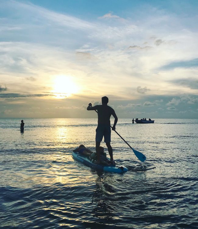 paddleboarding with children at sunset at cape charles beach