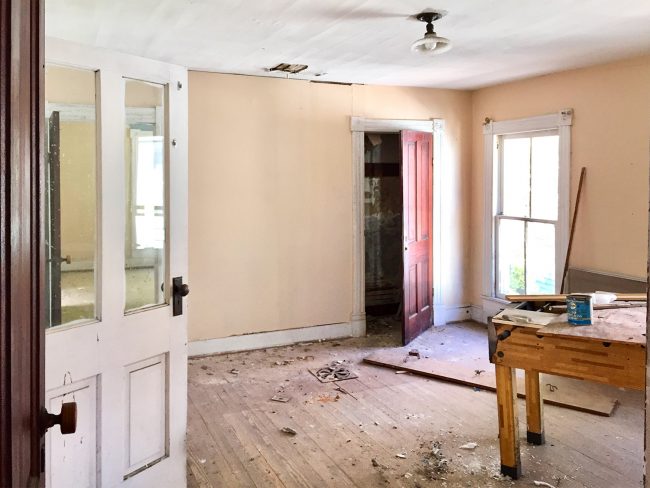 Before Photo of Beach House Middle Bedroom and Hallway With Football Table