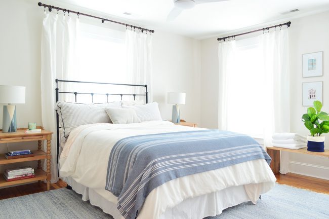 After Photo Of Front Bedroom With Blue Rug and Bedding