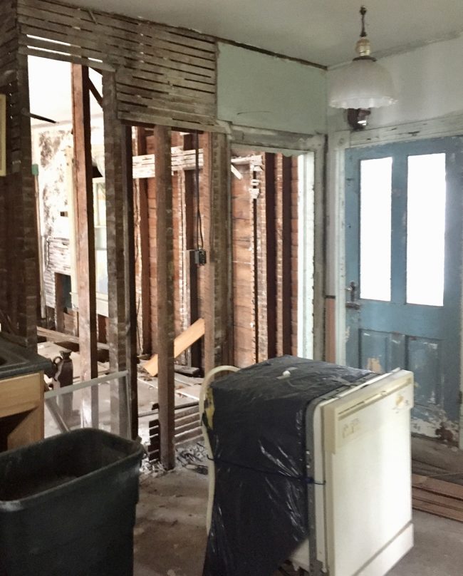 Before Photo Of Downstairs Kitchen With Appliances In The Middle Of The Room