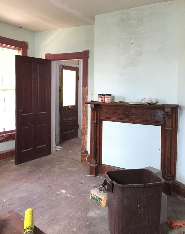 Before Photo Of Beach House Living Room With Red Trim And Fake Fireplace Mantle