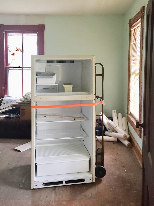 Before Photo Of Beach House Living Room With Fridge In Middle Of Space