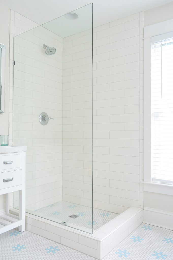 Frameless Glass Shower Panel In Subway Tile Bathroom