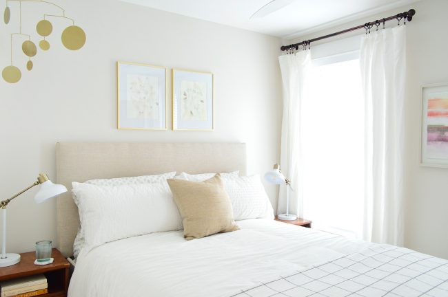 beach house guest bedroom with headboard in it