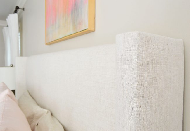 detail on upholstered bed with linen texture