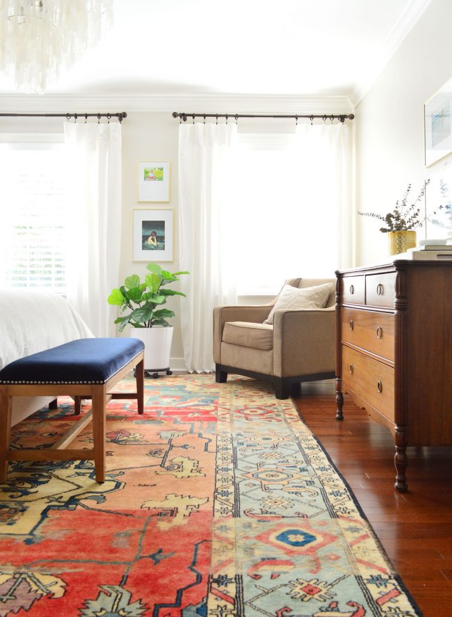 white ikea lenda curtains hung in master bedroom