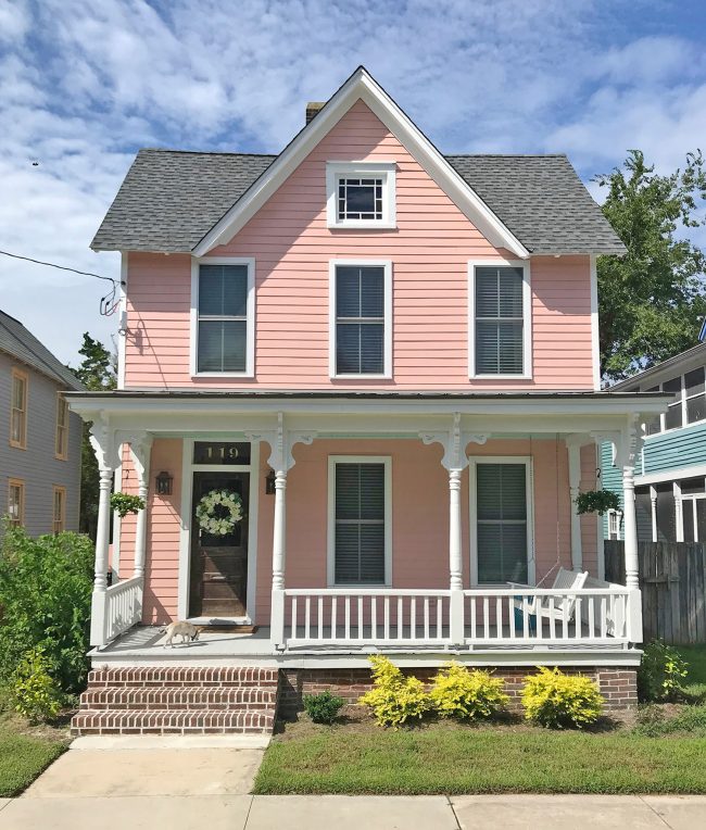 After Photo Of Pink Historic Beach House In Cape Charles Virginia With Mellow Coral Siding White Trim And Brick Stairs