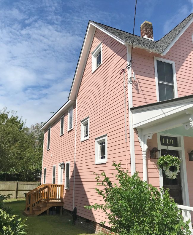 Finished View Of Restored Side of Historic Beach House With Repaired Side And Mellow Coral Siding