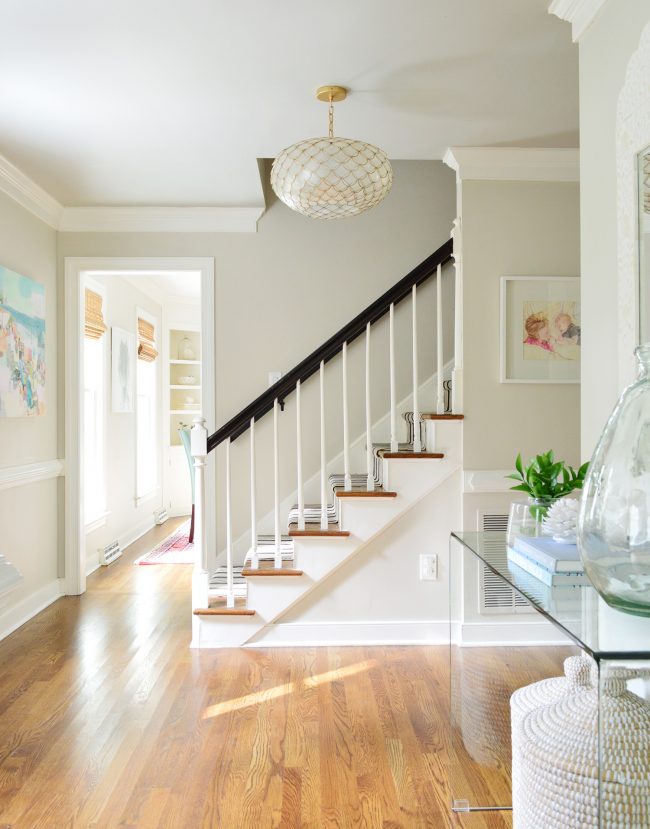 After Photo Of Foyer With Hardwood Floors And Capiz Pendant Light