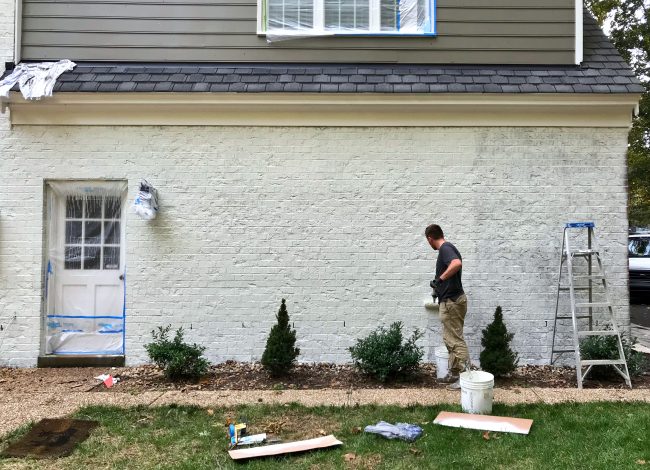 Painting Brick White Day 3 Josh Rolling Back Garage