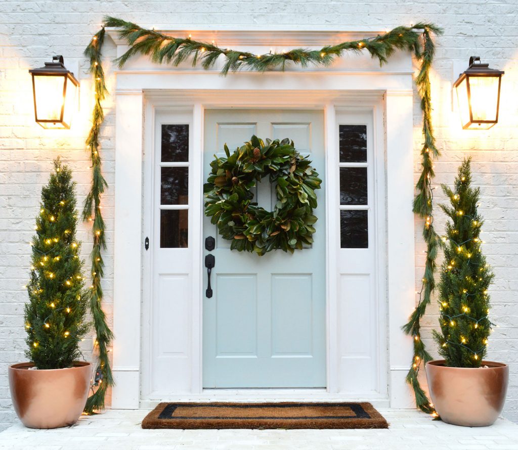 Holiday Front Porch With Garland And Faux Trees