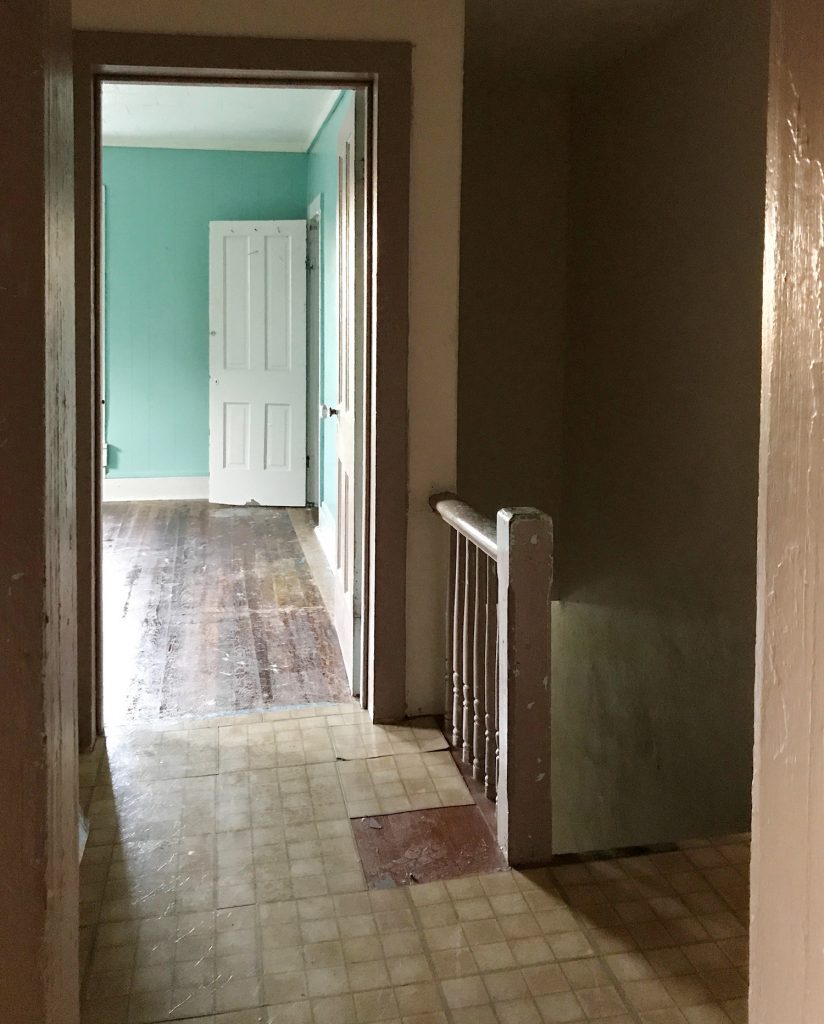 Duplex Floor Refinish Before Right Hallway