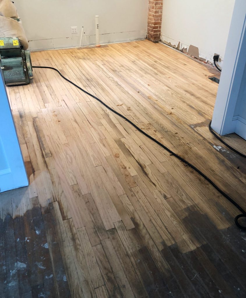 Duplex Floor Refinishing During Sanding