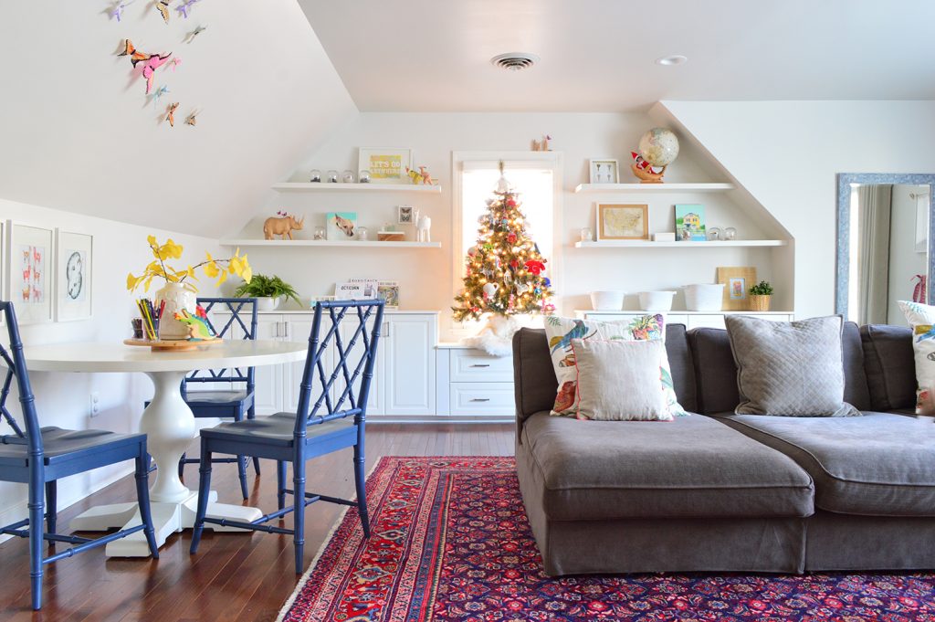 Bonus Room With Large Couch And Drawing Table With Ornate Blue Chairs