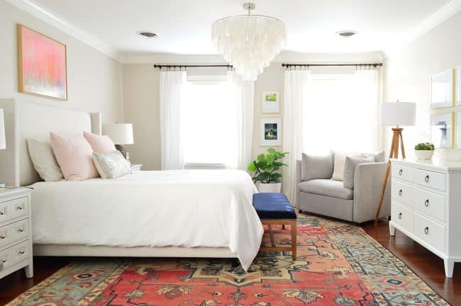 After Photo Of Traditional Bedroom With Vintage Rug And Capiz Chandelier