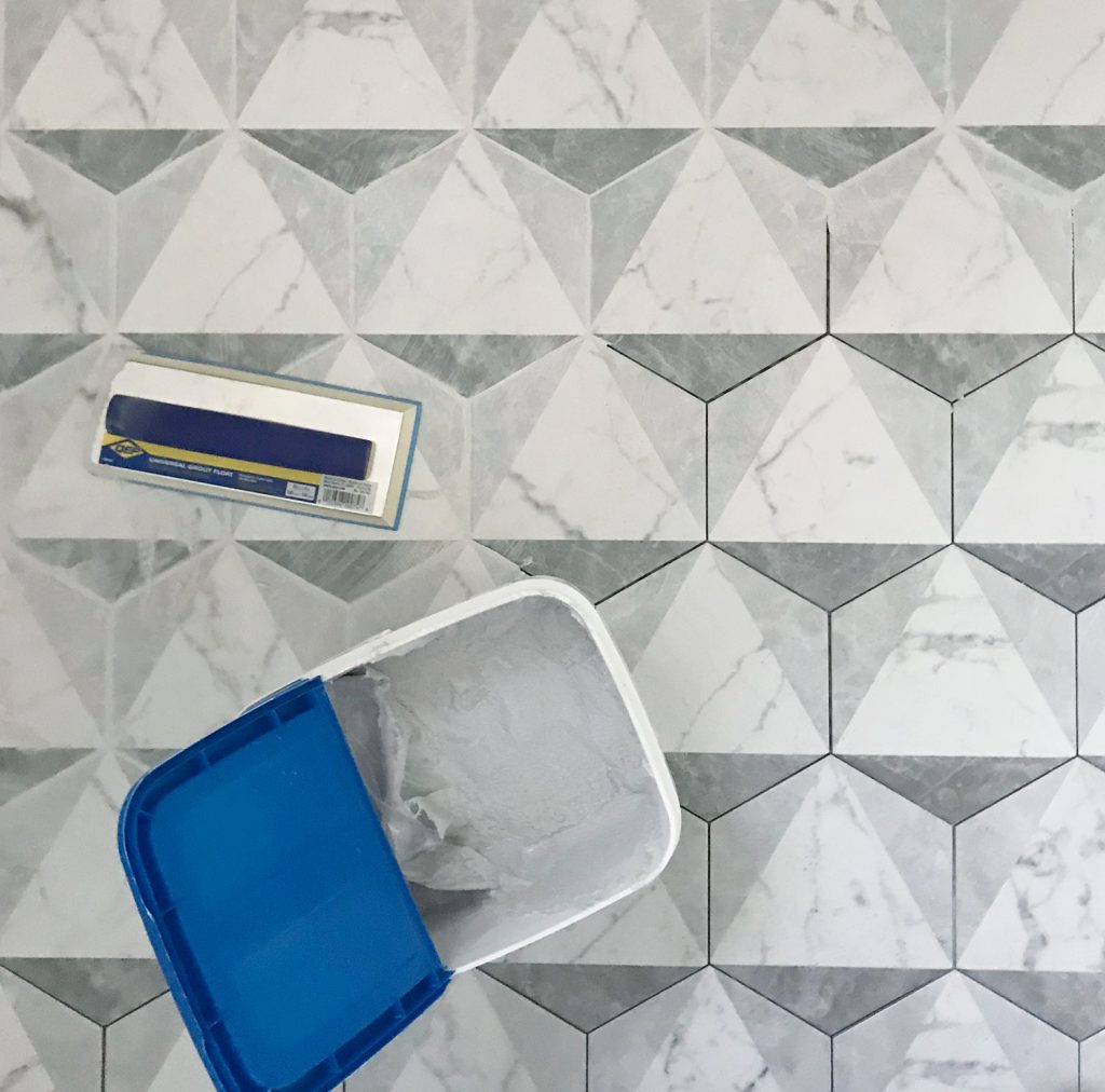 marble hex tiles getting grouted with mapei grout