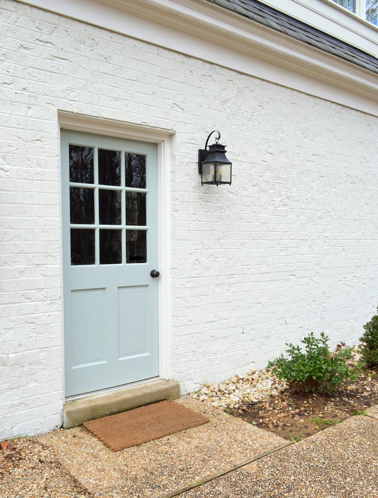 Back Door Painted Tranquility In High Gloss Against White Brick Garage