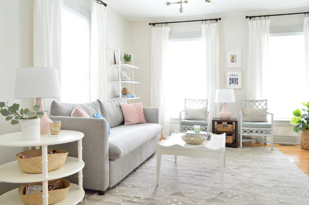 bright neutral living room gray sofa white heron walls