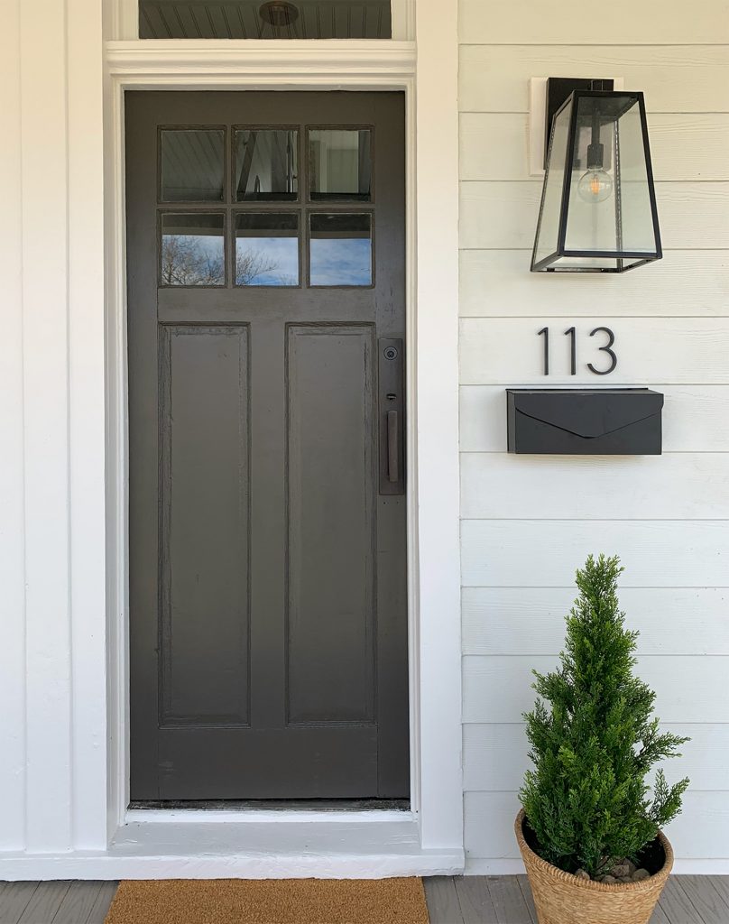 One Side Of Duplex Front Porch With Dark Door And Hardware