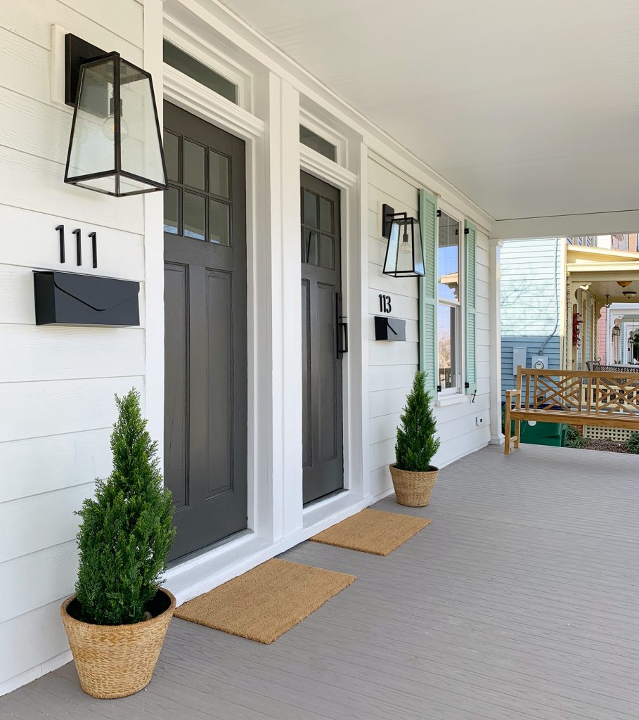 Duplex Front Porch With Matching Doors And Wood Bench