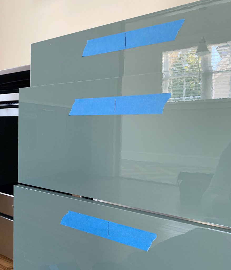 Center Lines Marked On Protective Tape On Kitchen Drawer Fronts