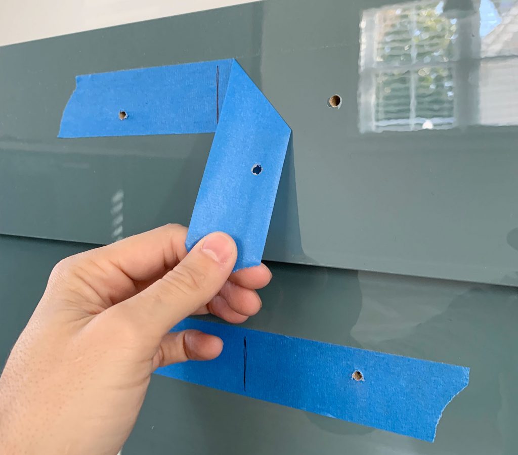 Peeling Protective Blue Tape Off Of Cabinet Drawer Front